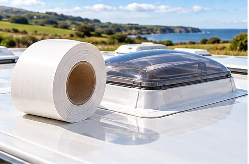 Roll of white sealing tape on a motorhome roof next to a rooflight