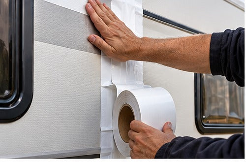 Sealing a caravan side wall joint with white tape