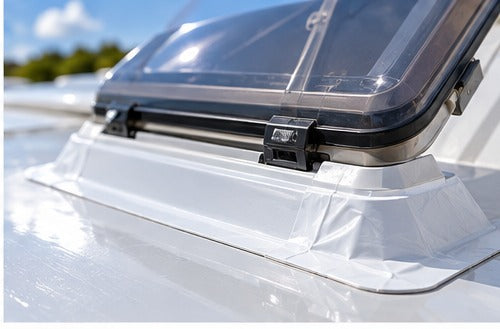 Caravan rooflight sealed with white weatherproofing tape